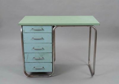 a green desk with five drawers and a metal frame