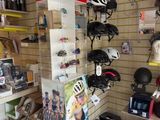 a bike shop with a lot of helmets on the shelves