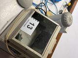 a computer monitor sitting on top of a table