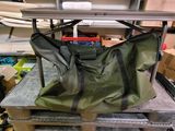 a green bag sitting on top of a table in a room