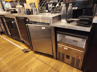 a kitchen with a lot of appliances on the counter