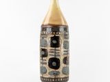 a brown and black vase with a number on it