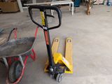a dolly truck and a hand truck in a garage