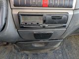 a car dashboard with a clock and radio in it
