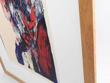 framed artwork of a red and blue abstract painting on a white wall
