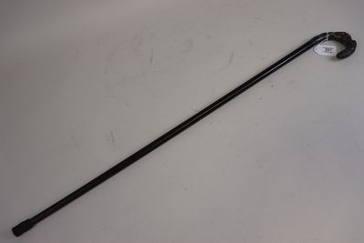 a close up of a cane on a table with a white background