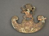 a brass plaque with an image of a man on it