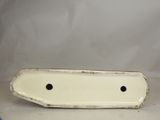 a small white plate with a hole in the middle