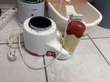 a blender that is sitting on the floor next to a bath tub