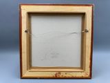 an old picture frame with a drawing of a fish in it