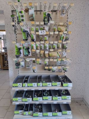 a large display of tools in a store for sale
