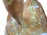 statue of a bird on a rock with a bird on it ' s back