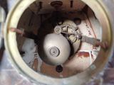 a close up view of the inside of an old clock
