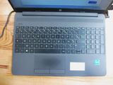 a laptop that is sitting on a table with a mouse