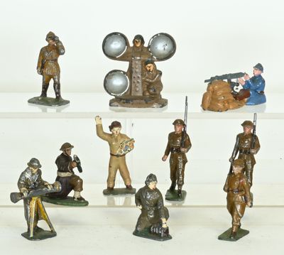 many figurines of soldiers on display on a shelf