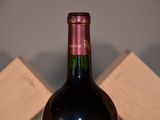 a bottle of wine that is sitting on a table