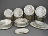 a lot of plates and bowls that are sitting on top of each other