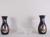 two vases sitting next to each other on a table
