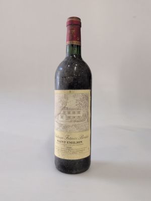 a bottle of wine that is sitting on a table