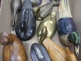a cardboard box filled with assorted metal objects