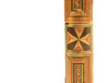 an image of a tall wooden object with a design on it