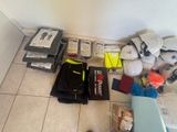 a lot of items on the floor in the room