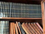 many old books on the shelves in the room