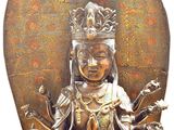 brass statue of a woman with a crown on her head