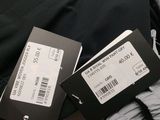 two tags on a pair of pants that are next to each other