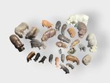 a lot of different animal figurines on a white surface