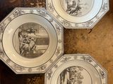 three plates with a picture of a man and a woman on them