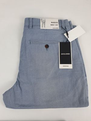 a close up of a pair of blue pants with a tag on it