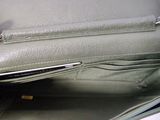 a green purse that is open on the table