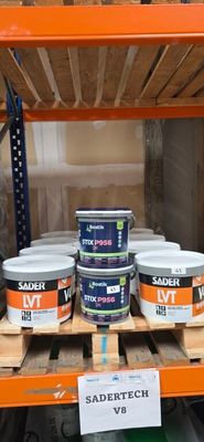 many cans of paint on a shelf in a store