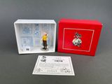 an image of a small figurine of a man in a red box