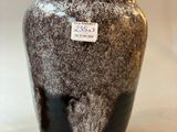 two vases that are sitting on a table