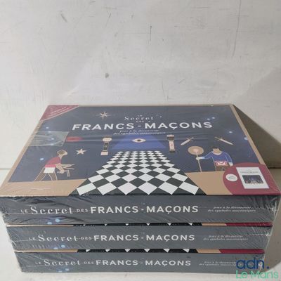 a stack of three books sitting on top of a table