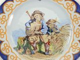 a plate with a picture of a man and a boy on it