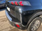 a black car with a red sticker on the back of it
