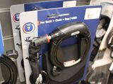 a lot of different types of hoses hanging on the wall