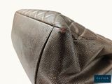 a close up of a purse on a white background