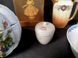 a picture of a teapot, a bowl, and a box on a table