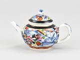 a teapot with a mickey mouse design on it