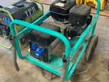 a small green cart with a water pump on it