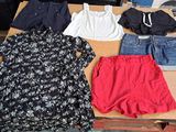 a table that has a lot of clothes on it