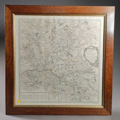a framed map of the city of london in a wooden frame