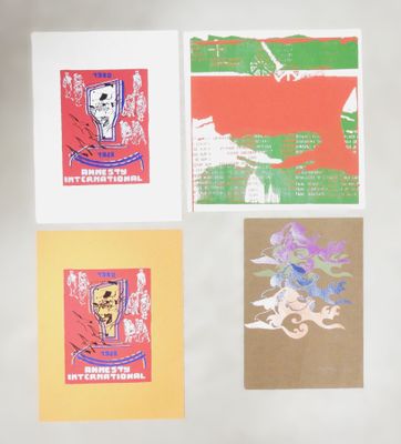 four cards with different designs on them on a white surface