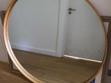 a mirror that is sitting on the floor in front of a mirror