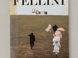 a book with a picture of a couple of people walking in a field