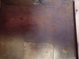 a metal box with writing on it sitting on a table